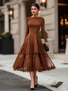 Elegant brown long-sleeved midi dress featuring a mesh tiered skirt in Hepburn style.