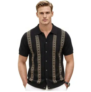 Detailed front view of men's black knit polo shirt with gold geometric jacquard stripes