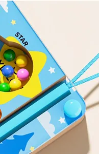 Close-up view of the convenient pen slot on a wooden magnetic maze toy for children