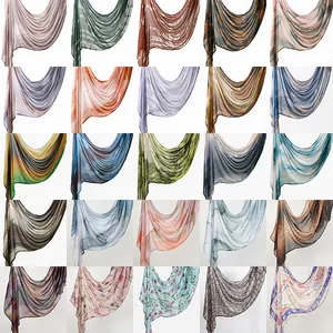 A grid display showing a large variety of printed rayon headscarves for women with patterns