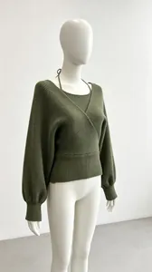 Close-up view of an olive green two-piece knit sweater set with wrap v-neck design