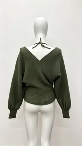 Close-up back view of dark green knitted wrap sweater with deep V-neck and halter tie