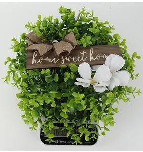 Weight display showing 161g for artificial green wreath with home sweet home plaque