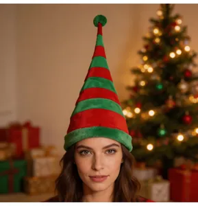Detail of a tall red and green striped velvet Christmas elf hat with a cute pom-pom.