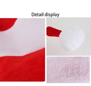 Detailed macro shot of soft red and white plush velvet fabric and fluffy pom-pom for a festive hat.
