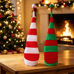 Two velvet long striped Christmas hats in red, green and white for holiday party decor