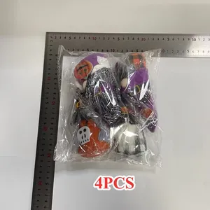 Set of 4 Halloween gnome plush ornaments shown with metal rulers for size reference