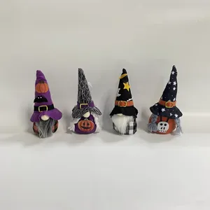 Detailed close-up view of four Halloween faceless gnomes plush dolls with festive witch hats
