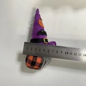 Detailed view of a purple Halloween gnome doll being measured with a professional steel ruler.