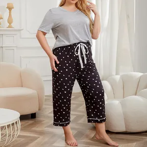 Women's plus size summer pajama set with gray short sleeve top and heart print pants