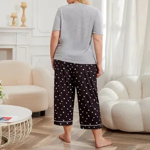 Women's plus size two-piece pajama set with grey short sleeve top and heart print pants