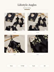 Detail view of floral satin pajama set showing camisole top and long pants