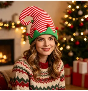 Festive red and white striped elf hat with a bell worn by a woman in a Christmas setting.