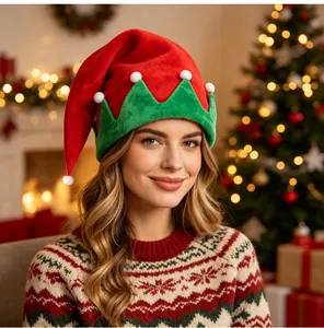 Detailed view of a festive red and green elf hat worn by a model in a cozy Christmas room