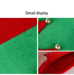 Macro detail showing vibrant red and green felt texture with a golden jingle bell