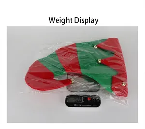 Macro detail of a red and green striped Christmas hat with bells weighing 52.8 grams