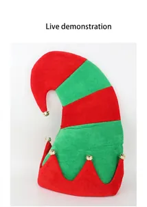 Detailed view of red and green striped Christmas elf hat featuring small golden bells