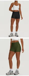 Detail view of high-waisted yoga shorts with side pockets in black and olive green.