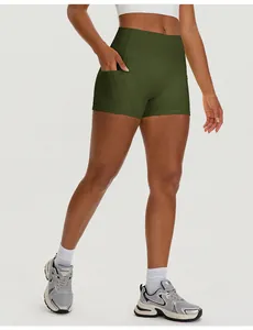 Detail view of high waisted olive green yoga shorts with side pocket for fitness