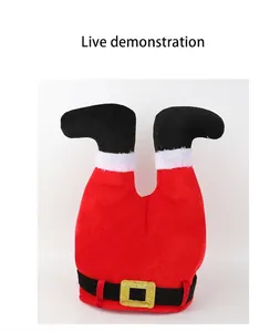 Detail view of plush red Santa Claus upside down legs hat with belt and boots decoration