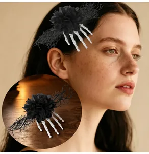 Detailed view of Halloween skeleton hand hair clip with black flower and mesh lace