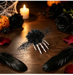 Detail view of a Halloween skeleton hand hair clip with black flower on a dark table