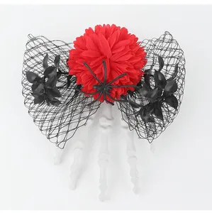 Detailed view of Halloween hair clip with skeleton hand and vibrant red flower