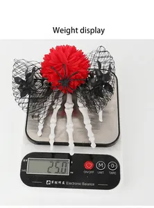 Detailed view of the Halloween ghost hand hair clip weighing approximately 25.0 grams