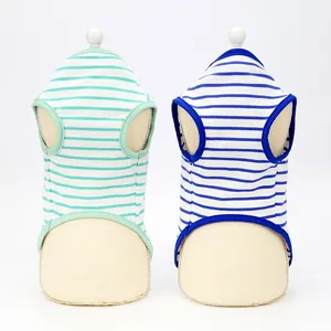 Detailed macro view of blue and green striped breathable cotton dog vests for summer season