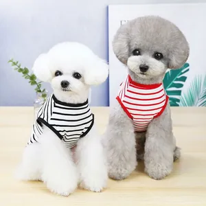 Two small poodles wearing black and red striped summer thin casual dog vests