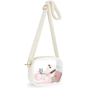 Detail view of clear PVC crossbody bag showing capacity for phone and accessories