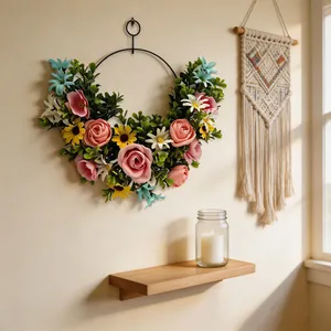 Artificial flower wreath wall decor hanging in a cozy home setting with warm sunlight