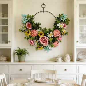 Creative artificial flower wreath hanging on a white wall in a dining room scene