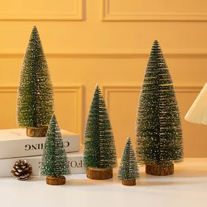 Detailed view of mini snow-flocked Christmas tree ornaments in various sizes.