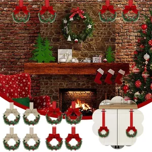 Festive Christmas mini wreaths with red bows for cabinet and home decoration