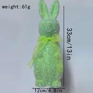 Detailed view of a green glitter Easter bunny ornament showing size and weight info
