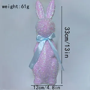 Pink glitter Easter bunny figurine with blue ribbon showing size and weight details