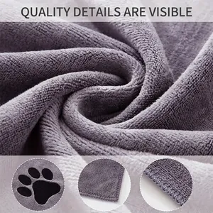 Macro view of quick-dry microfiber pet towel fabric with reinforced edges and paw print detail