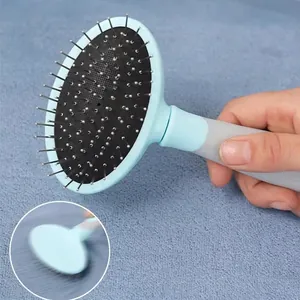 Detailed close-up of a blue pet grooming brush resting on a microfiber bath mat