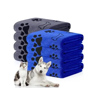 Detailed view of soft absorbent microfiber pet towels with cute paw and bone prints