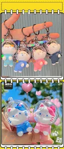 Close-up of cute astronaut cat PVC keychains in various colors for bag accessories