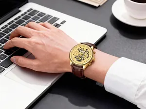Detail shot of a WOKAI men's quartz sports watch with a stylish brown leather strap
