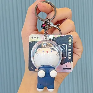 Cute cat astronaut keychain in space suit with holographic background card accessory