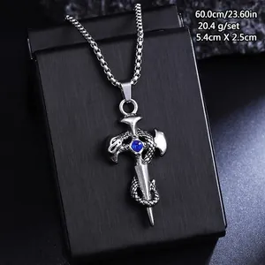 Detail view of retro titanium steel cross necklace with snake design and blue gem