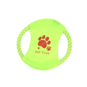Close-up of green dog cotton rope toy with red paw prints for interactive teeth cleaning.