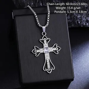 Close-up of a vintage titanium steel cross pendant necklace with crystal details