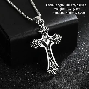 Close-up detail of vintage punk stainless steel cross pendant necklace with heart motif design