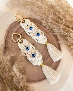 Handmade bohemian macrame evil eye keychain with tassel and a golden heart clasp