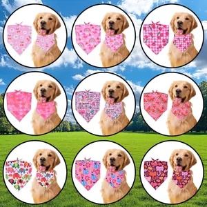 Collection of pink patterned pet bandanas shown on a Golden Retriever in a park