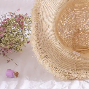 Breathable women's wide brim straw sun hat with fringed edges for summer protection